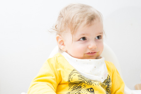 One very  cute  eleven  mounts old baby eatingの写真素材