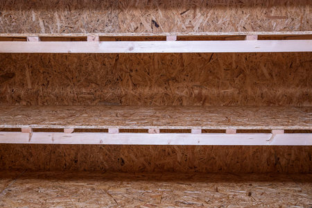 OSB racks, shelves are designed for storing things. Dressing room in the house. Organization of...