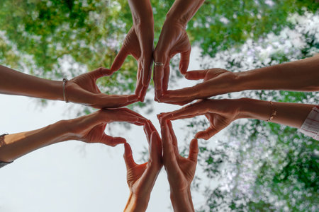 Team stacks hands in a workshop for teambuilding and teambuildingの写真素材