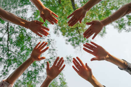 Team stacks hands in a workshop for teambuilding and teambuildingの写真素材