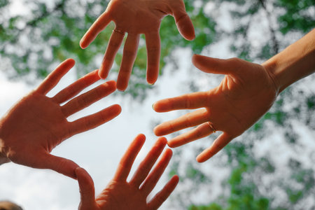 Team stacks hands in a workshop for teambuilding and teambuilding