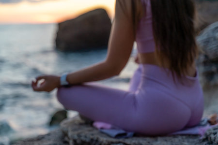 Young woman practicing yoga outdoors. Harmony and meditation concept. Healthy lifestyle