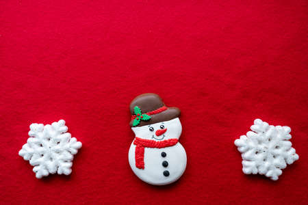 Christmas decorations layout or flatlay with fir branches and cones on red background.Eco natural frame. winter, new year Holidays concept as top view, copyspace. greeting card templateの写真素材