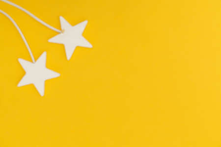 Two golden party magic wands and sequins on a white background. Copy space.の写真素材