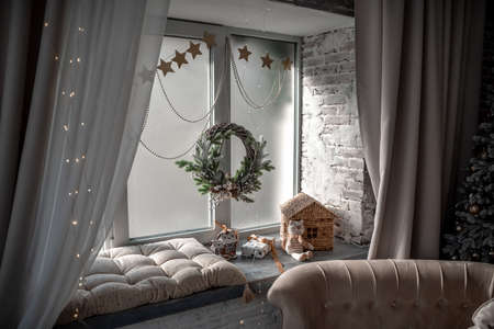 Window sill with New Years elements - Christmas trees, decorations, Christmas balls. Merry Christmas and Happy New Year greeting card. Cozy backgroundの写真素材