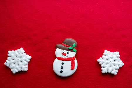 Christmas decorations layout or flatlay with fir branches and cones on red background.Eco natural frame. winter, new year Holidays concept as top view, copyspace. greeting card templateの写真素材