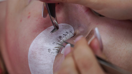 Eyelash Extension Procedure. Woman Eye with Long Eyelashes. Lashes, close up, macro, selective...