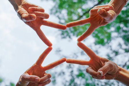 Team stacks hands in a workshop for teambuilding and teambuildingの写真素材