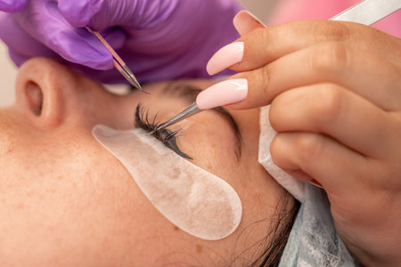 Eyelash extension procedure. Woman eye with long eyelashes. lashes, close up, macro, selective...