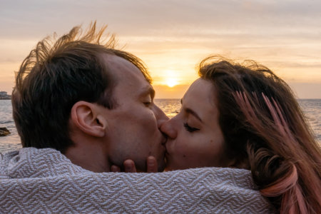 Portraits of lovers, romantic couple of lovers hugging, kissing, touching, eye contact at sunset,...