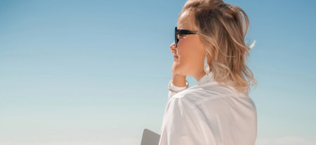 Business woman on nature in white shirt