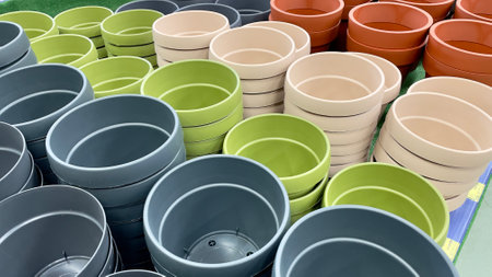 Close-up of empty flower pots in a store or greenhouse. Colorful pots for plants. Gardening and landscape design conceptの写真素材