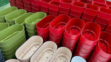 Close-up of empty flower pots in a store or greenhouse. Colorful pots for plants. Gardening and landscape design conceptの写真素材