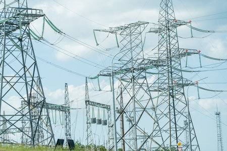 High voltage towers with sky background. Power line support with wires for electricity transmission....