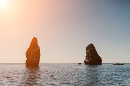 Two rocks stick out of the water in the middle of the turquoise sea. Scenic ocean views. High quality photo. Like in Icelandの写真素材