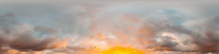 Sunset sky panorama with bright glowing pink Cumulus clouds. HDR 360 seamless spherical panorama. Full zenith or sky dome for 3D visualization, sky replacement for aerial drone panoramas.の写真素材
