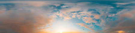 Sunset sky panorama with bright glowing pink Cumulus clouds. HDR 360 seamless spherical panorama....