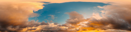 Dramatic sunset sky panorama with bright glowing red pink Cumulus clouds. HDR 360 seamless spherical panorama. Sky dome in 3D, sky replacement for aerial drone panoramas. Weather and climate change.の写真素材
