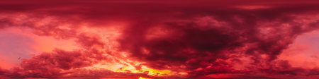 Dramatic sunset sky panorama with bright glowing red pink Cumulus clouds. HDR 360 seamless spherical panorama. Sky dome in 3D, sky replacement for aerial drone panoramas. Weather and climate change.の写真素材
