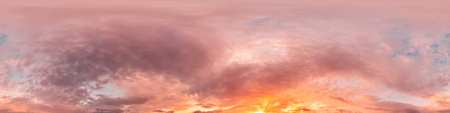 Sunset sky panorama with bright glowing pink Cirrus clouds. HDR 360 seamless spherical panorama....