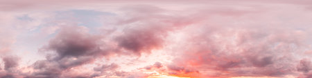 Dramatic sunset sky panorama with bright glowing red pink Cumulus clouds. HDR 360 seamless spherical...