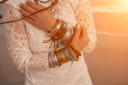 Model in boho style in a white long dress and silver jewelry onの写真素材