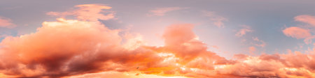 Dramatic sunset sky panorama with bright glowing red pink Cumulus clouds. HDR 360 seamless spherical...