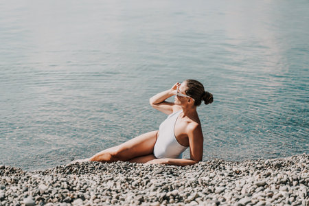 Woman white bikini beach tan. Happy woman in swimwear on vacation. Summer travel holidays vacation on the seaの写真素材