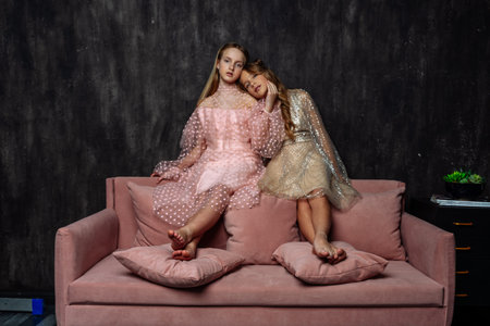 Close-up portrait of a beautiful model girl posing in the studio on a dark background.の写真素材