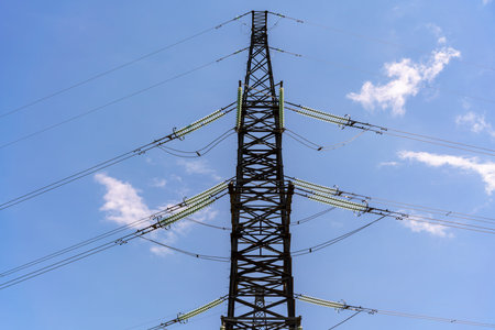 High voltage towers with sky background. Power line support with wires for electricity transmission....
