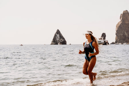 Woman beach vacation photo. A happy tourist in a blue bikini enjoying the scenic view of the sea and...