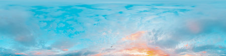 Sunset sky panorama with bright glowing pink Cirrus clouds. HDR 360 seamless spherical panorama. Full zenith or sky dome in 3D, sky replacement for aerial drone panoramas. Climate and weather change.の写真素材