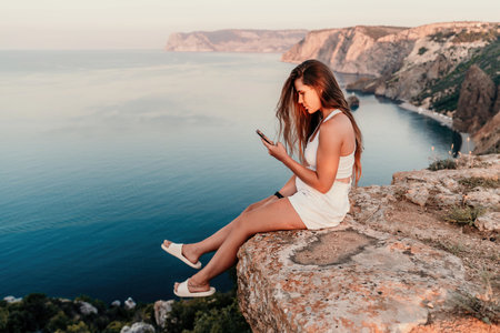 Portrait of a happy woman with long hair against the seaの写真素材