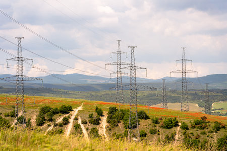High voltage towers Electric pole. Power line support with wires for electricity transmission. High...
