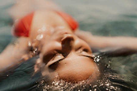 Happy woman sea relaxing floating in transparent sea water on summer holiday. Travel leisure recreation lifestyle, female in nature.の写真素材