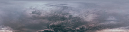 Dark moody rain clouds in dramatic overcast sky. Seamless 360 HDR spherical panorama. Full zenith or sky dome in 3D environment, sky replacement for aerial drone panoramas. Climate and weather change.の写真素材
