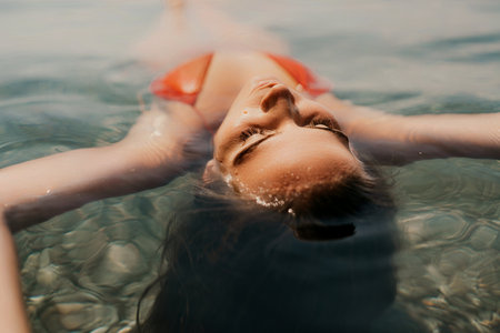 Happy woman sea relaxing floating in transparent sea water on summer holiday. Travel leisure recreation lifestyle, female in nature.の写真素材