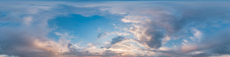 Sunset sky panorama with bright glowing pink Cumulus clouds. HDR 360 seamless spherical panorama....