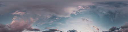 Sunset sky panorama with bright glowing pink Cumulus clouds. HDR 360 seamless spherical panorama....