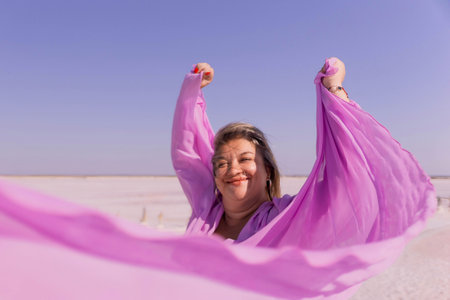 Woman Pink Dress Salt Flats Joyful Expressionの写真素材