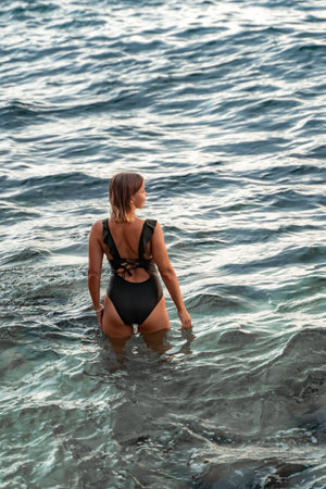 Woman Ocean Swimsuit Back View Sea Waterの写真素材