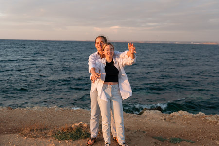 Couple Selfie Beach Sunset - A couple takes a selfie on a beach at sunset.の写真素材