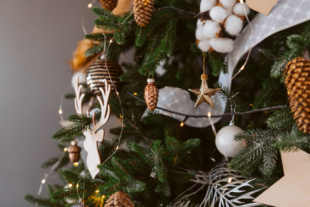 A Christmas tree with a star and a deer ornamentの写真素材