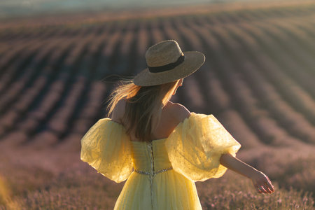 Lavender Field Woman Dress: Sunset, Provence, France. Yellow dress woman enjoying idyllic summer evening lavender field.の写真素材