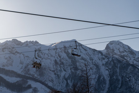 Chairlifts Mountains SkiResort: Winter scenic view, snowy peaks, transportation.の写真素材