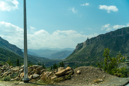 A pole is standing in the middle of a rocky fieldの写真素材