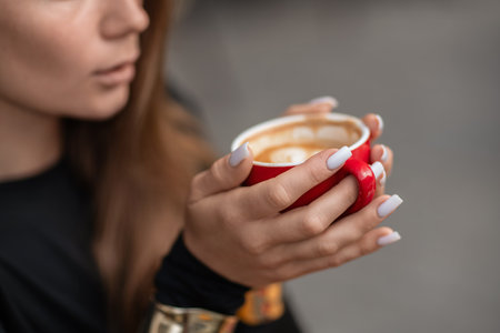 Coffee Cup Woman, Red, Morning. Woman holds coffee in a red cup, enjoying the warmth and aroma in the morning.の写真素材