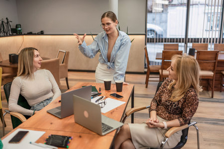 Business Meeting Women Discussing Strategy Laptops Office Space for Project Collaboration