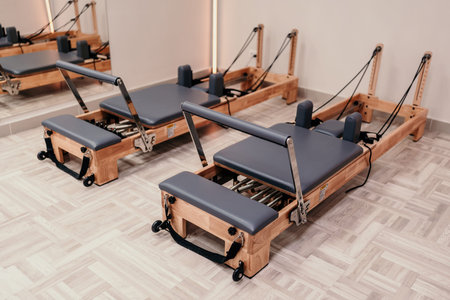 Pilates reformers equipment fitness studio wood machines workout exercise room