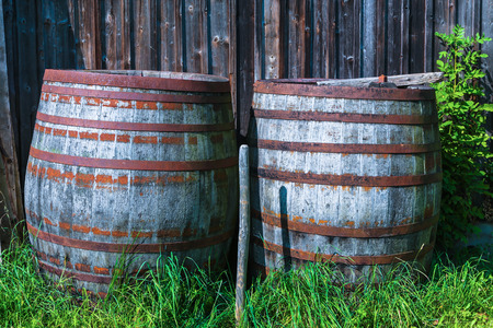 old wooden barrel in front of a shedの写真素材